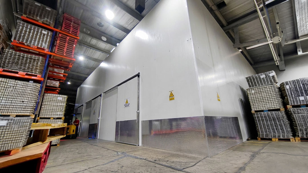 Construction workers demonstrating how to install IMPs faster using symmetrical GlobeWall panels by Globe Panels.